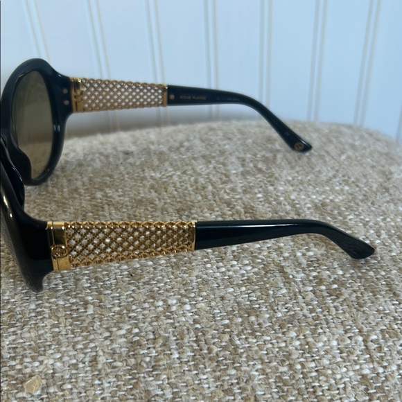 Authentic Gucci Elegant Black Sunglasses with Gold plated temples. main image 9
